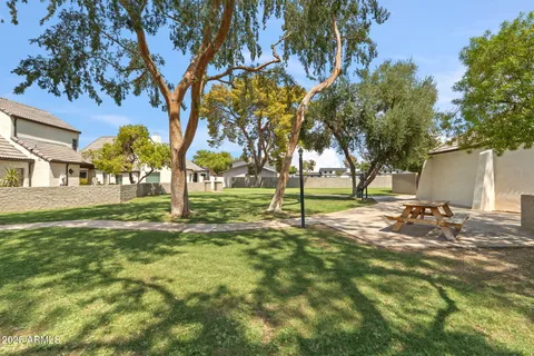 a view of a chairs and table in patio