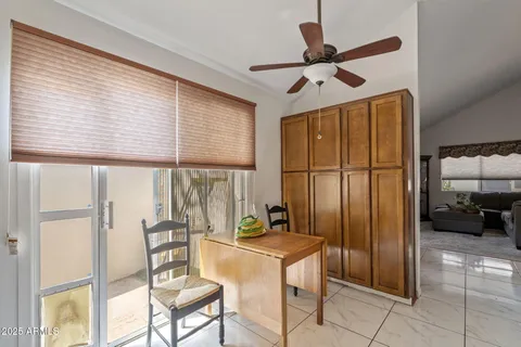 a view of a livingroom with furniture and a window