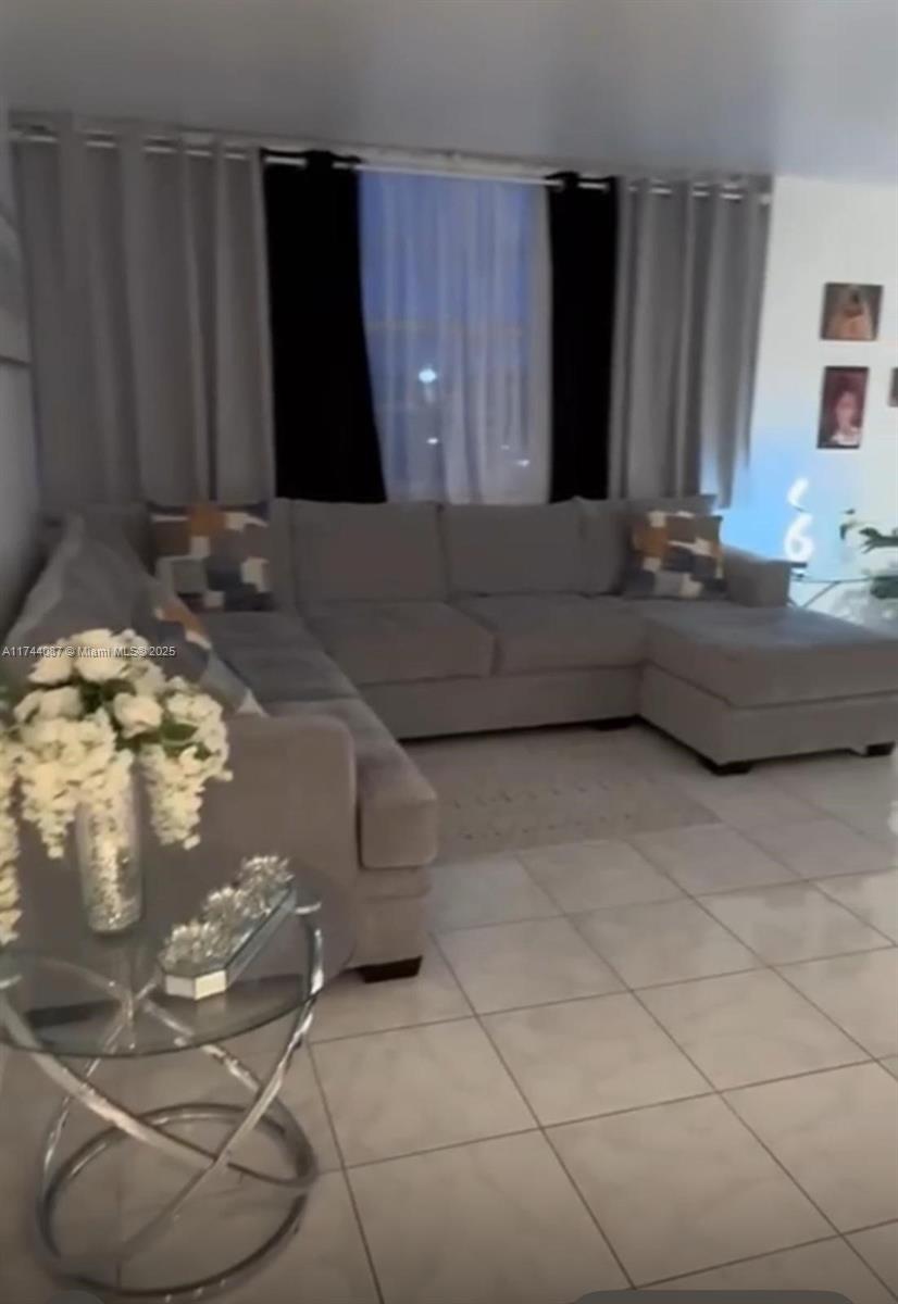 Ojus Miami, FL 33179 - Photo 2 of 11 a living room with couches and painted walls