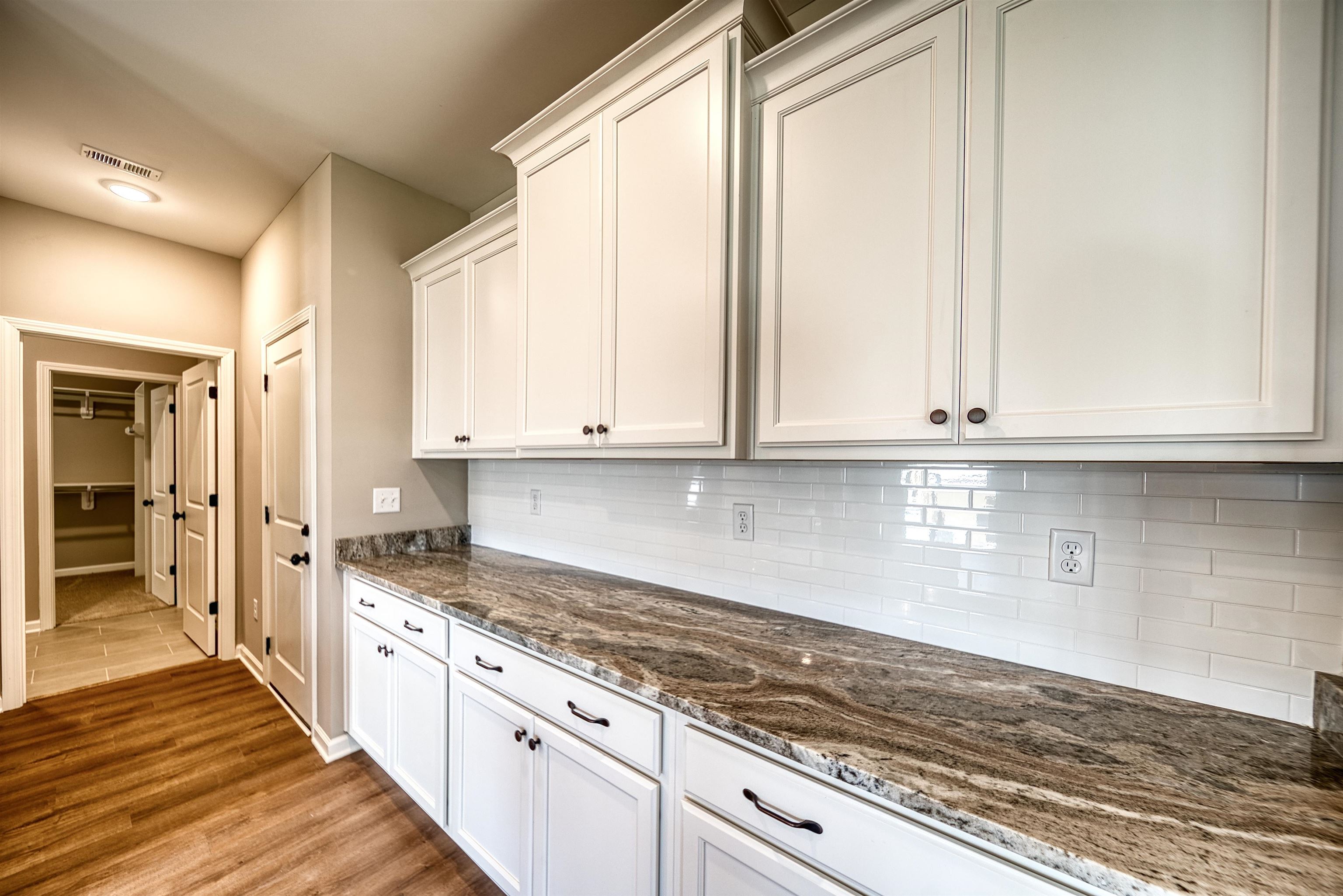 515 Garland Drive Covington, TN 38019 - Photo 19 of 38 a kitchen with granite countertop a sink stainless steel appliances and cabinets