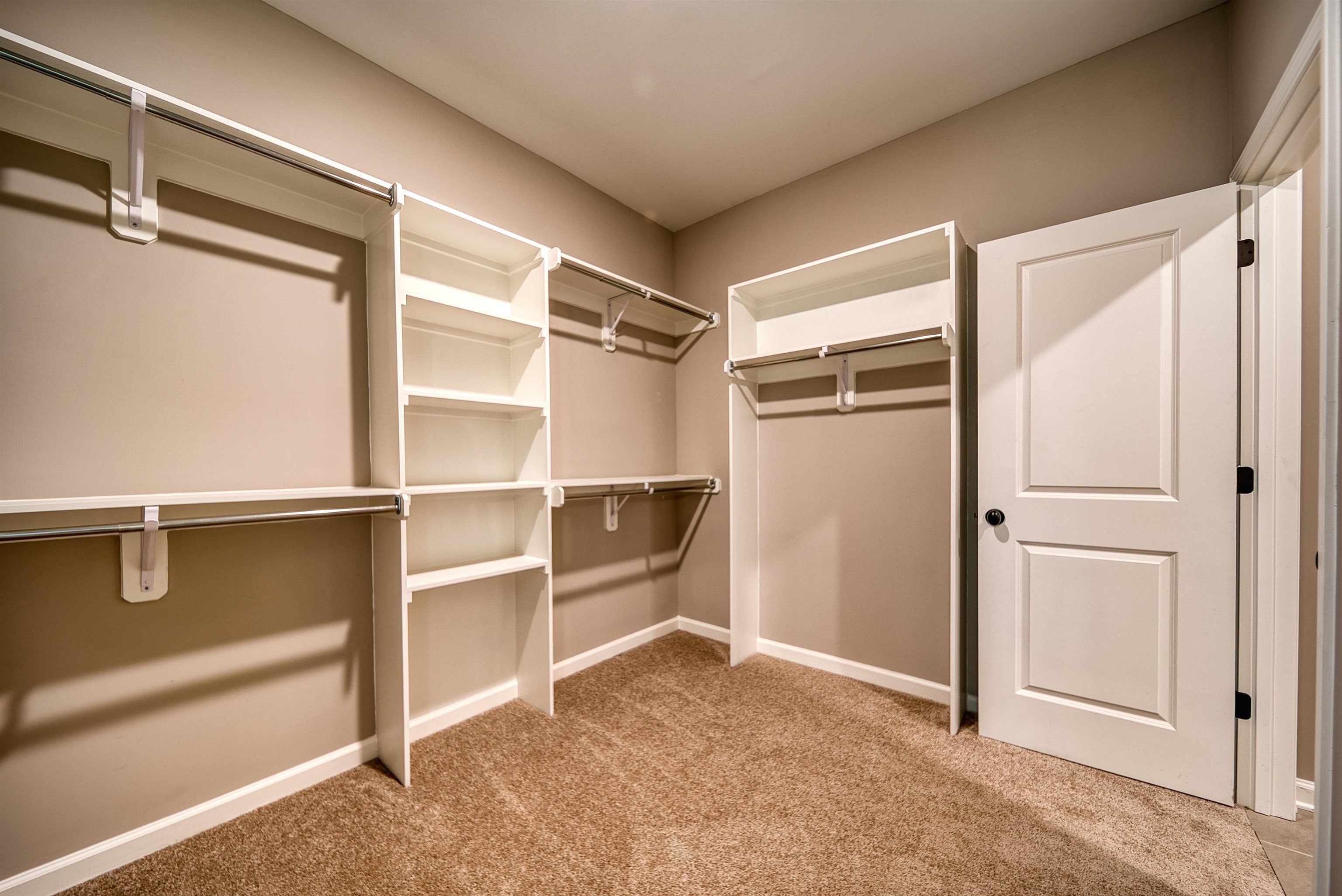 515 Garland Drive Covington, TN 38019 - Photo 26 of 38 a view of walk in closet with empty racks