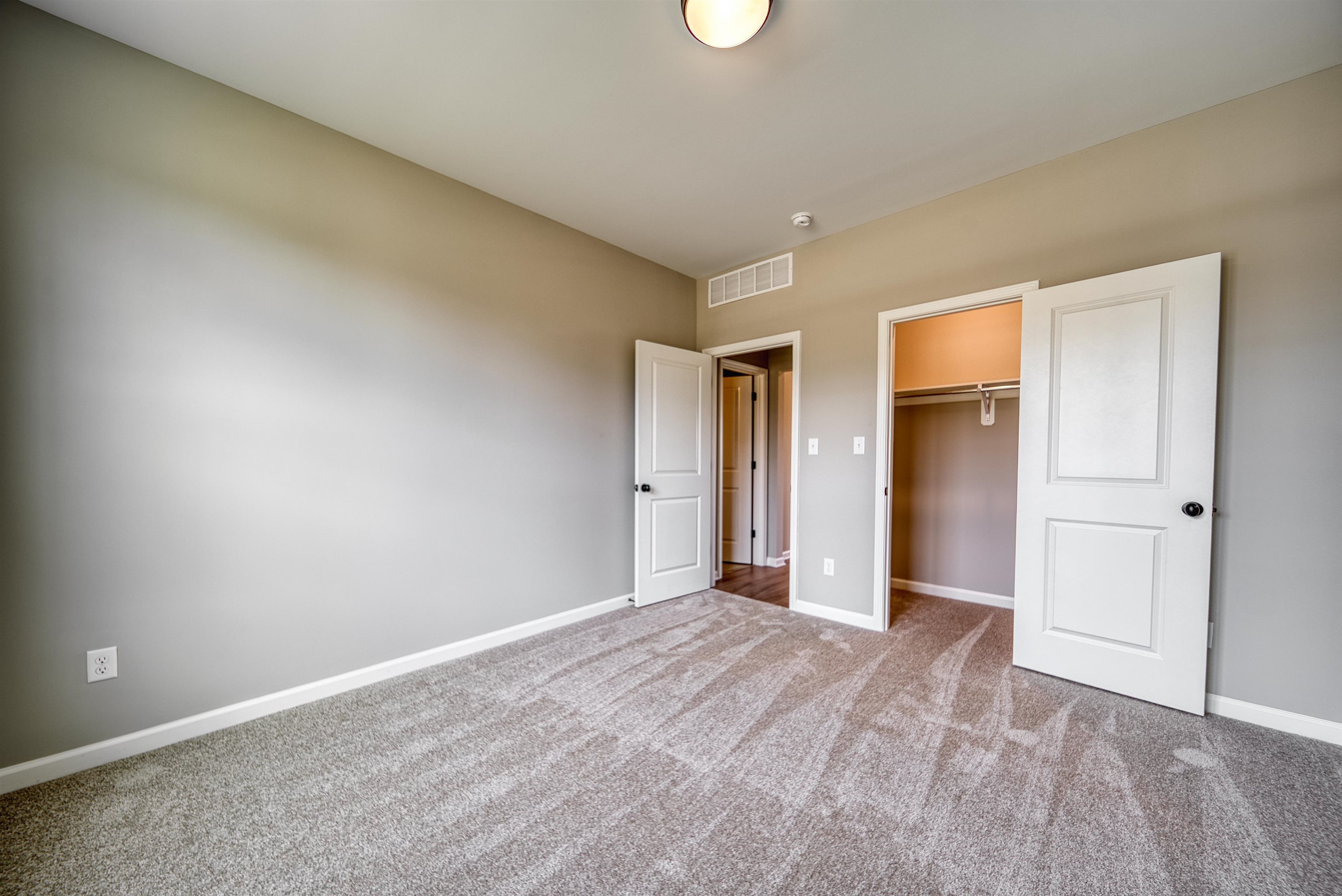 515 Garland Drive Covington, TN 38019 - Photo 31 of 38 Unfurnished bedroom featuring baseboards and carpet