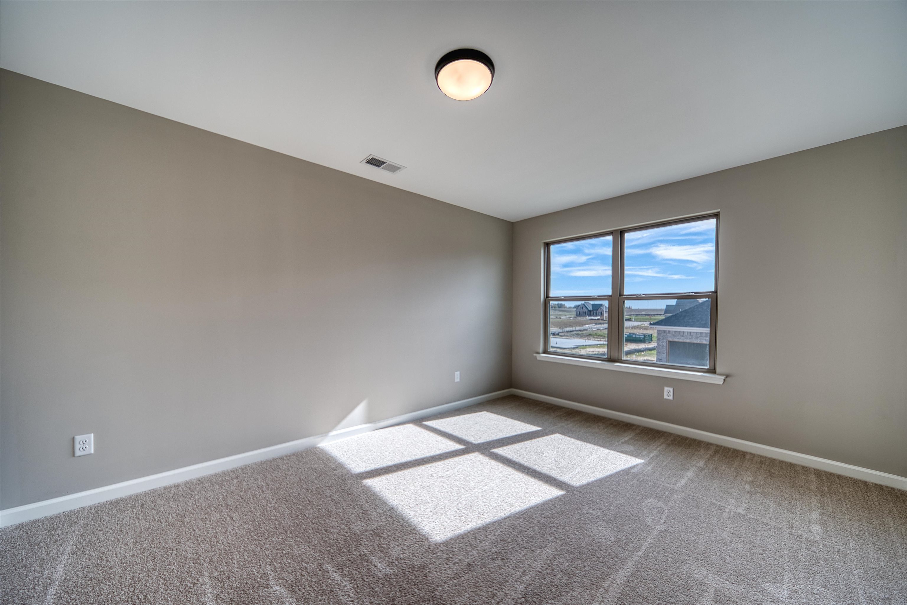 515 Garland Drive Covington, TN 38019 - Photo 34 of 38 Spare room featuring baseboards and carpet