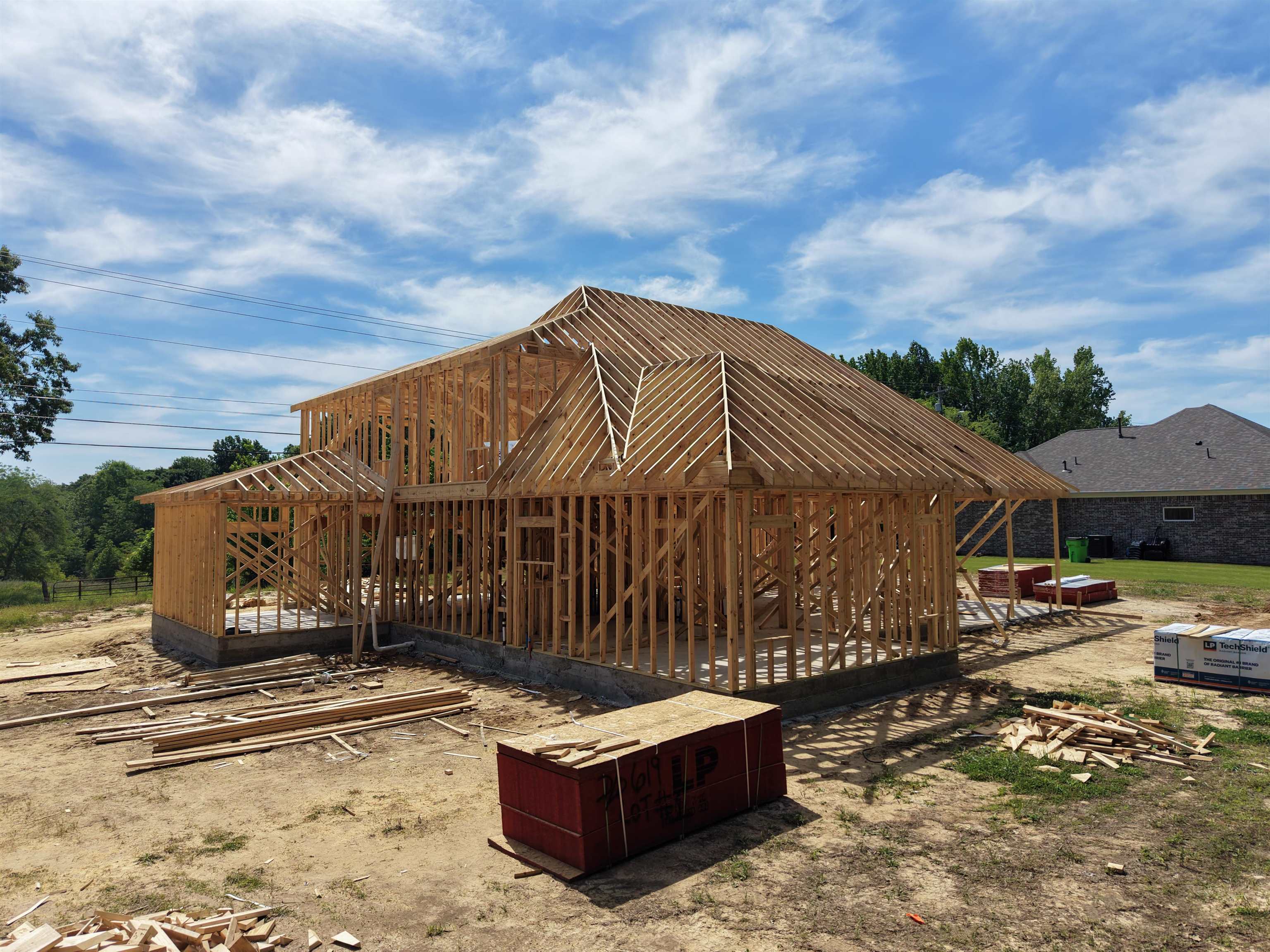 515 Garland Drive Covington, TN 38019 - Photo 6 of 38 New construction framing featuring a multi-level roofline and partial rear porch