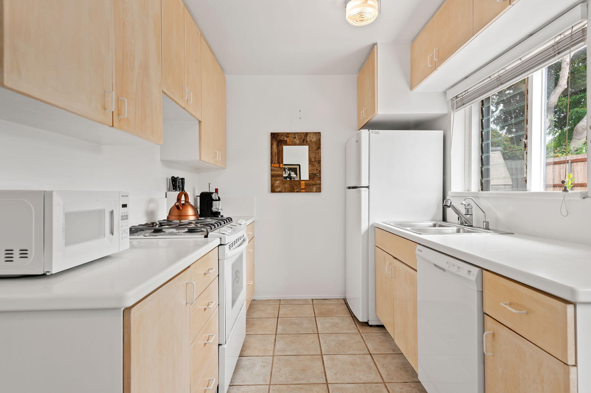 1375 Virginia Road Santa Barbara, CA 93108 - Photo 16 of 37 a kitchen with a sink cabinets and window