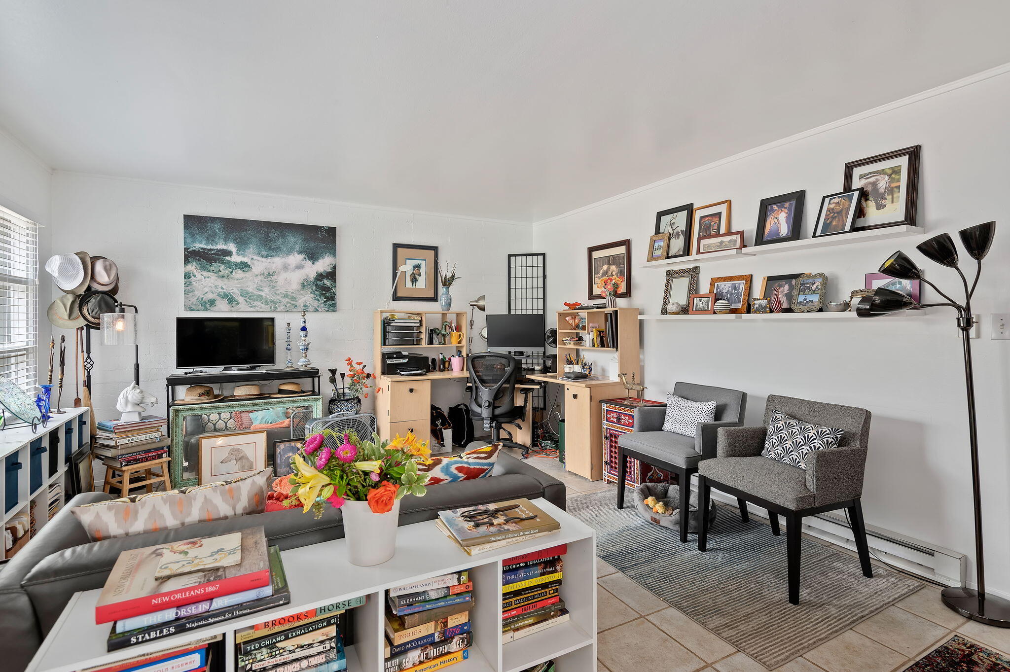 1375 Virginia Road Santa Barbara, CA 93108 - Photo 24 of 37 a room with furniture a flat screen tv and a dining table with bookshelf