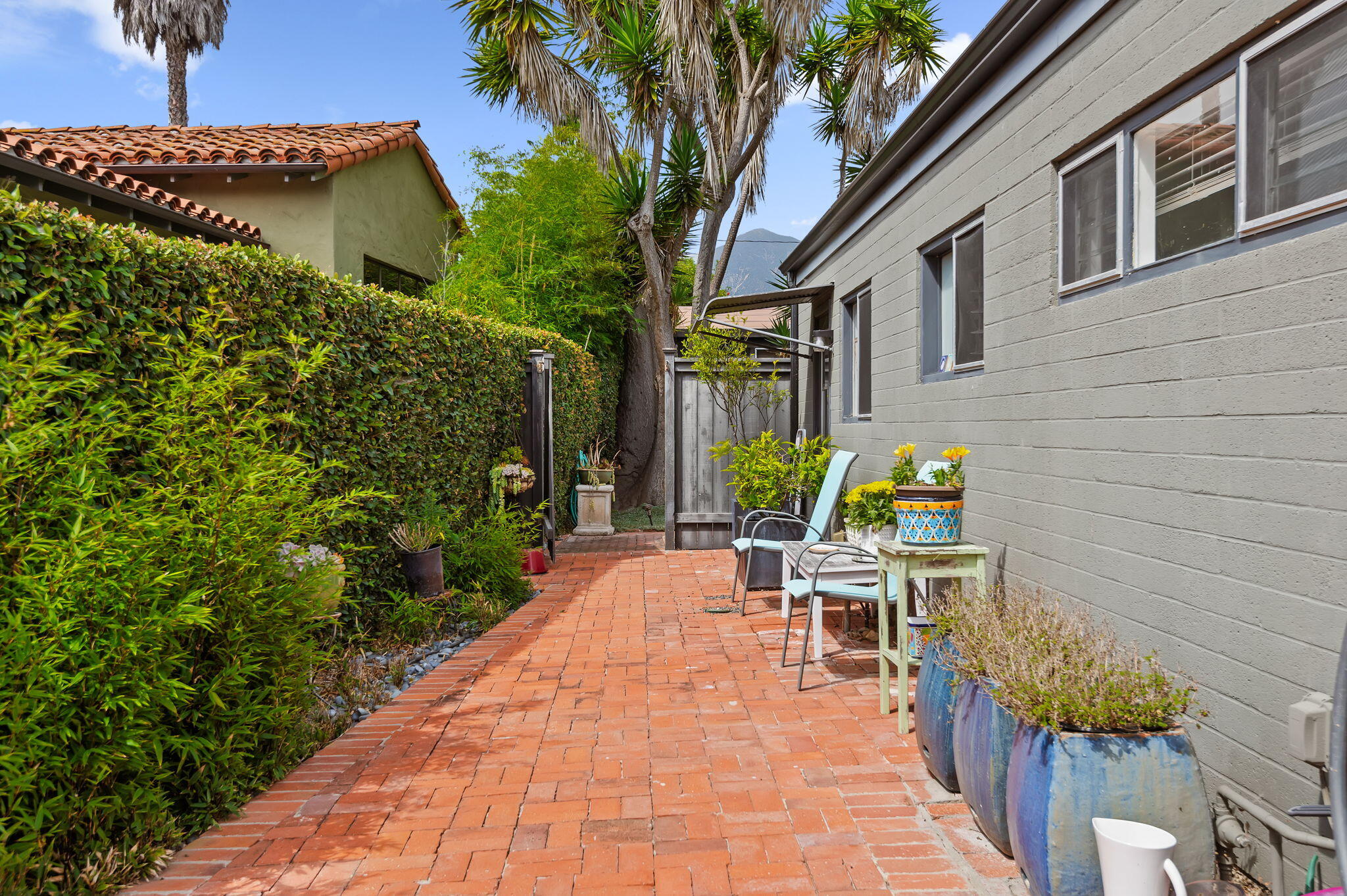 1375 Virginia Road Santa Barbara, CA 93108 - Photo 31 of 37 a view of a patio with chairs and potted plants