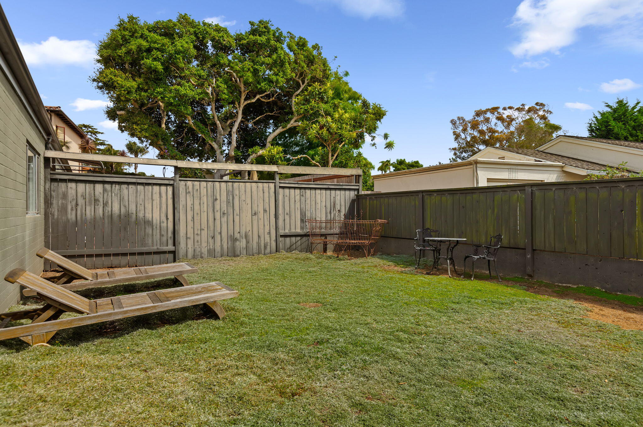 1375 Virginia Road Santa Barbara, CA 93108 - Photo 32 of 37 a backyard of a house with table and chairs
