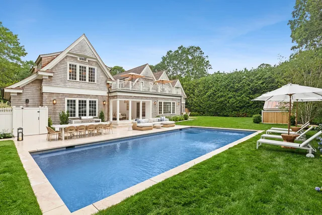 a front view of house with yard and outdoor seating