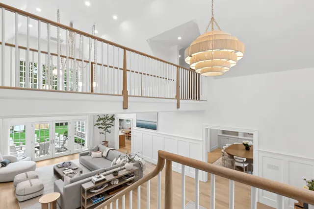 a bedroom with furniture and a chandelier