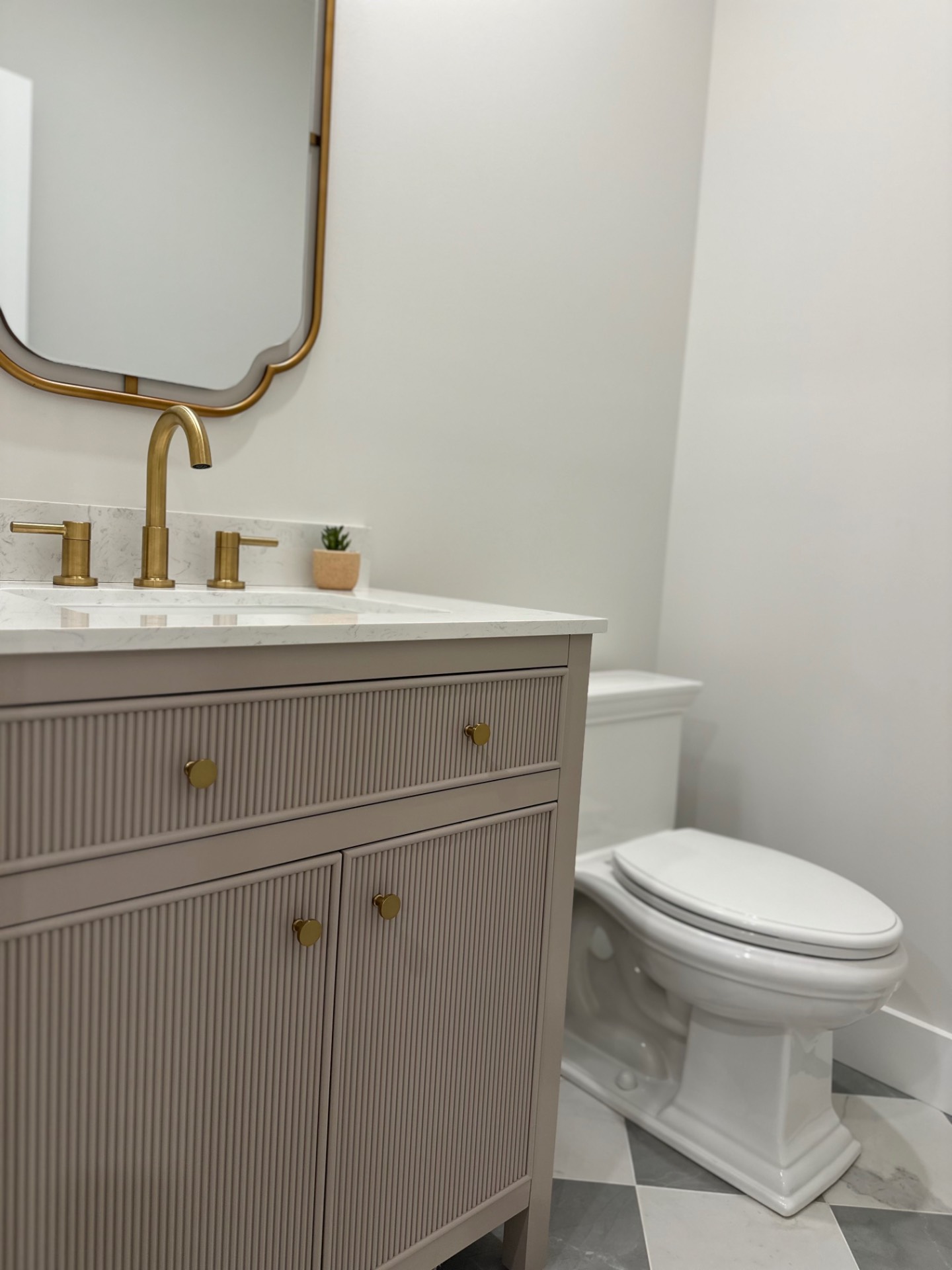 8 Barclay Court East Hampton, NY 11937 - Photo 40 of 48 a bathroom with a toilet and a sink