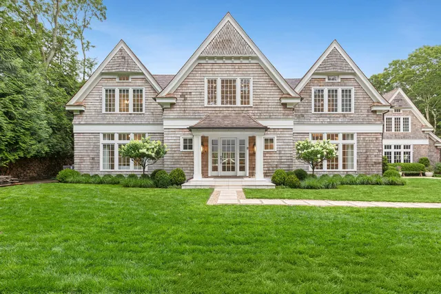 front view of a house next to a yard