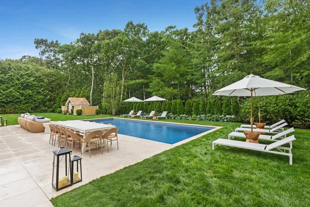 a view of a house with a yard porch and sitting area