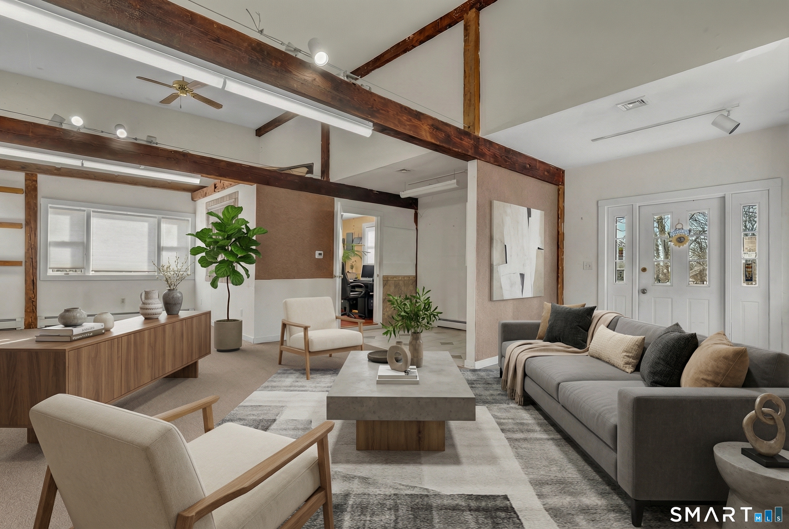 a living room with furniture kitchen view and a chandelier