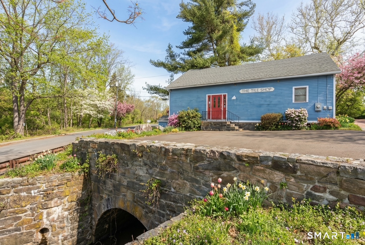 51 Mill Road Guilford, CT 06437 - Photo 1 of 30 a front view of a house with a yard
