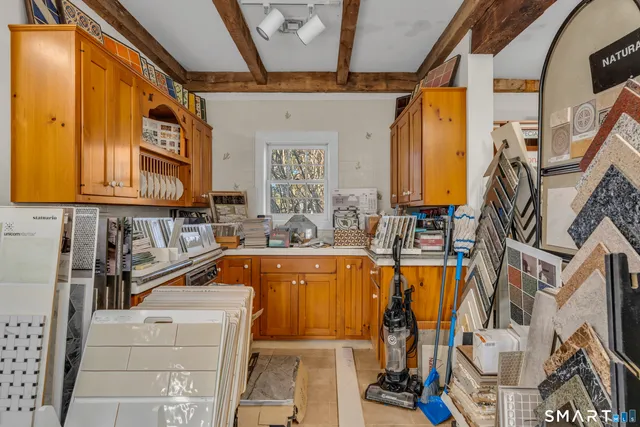 a view of a kitchen with furniture and staircase