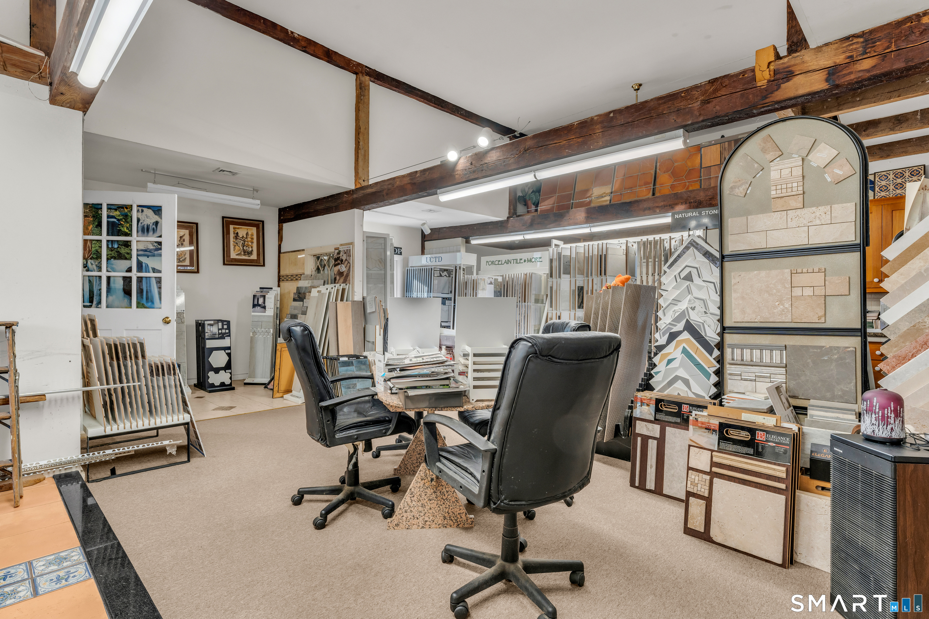 51 Mill Road Guilford, CT 06437 - Photo 17 of 30 a view of a livingroom with workspace and a window