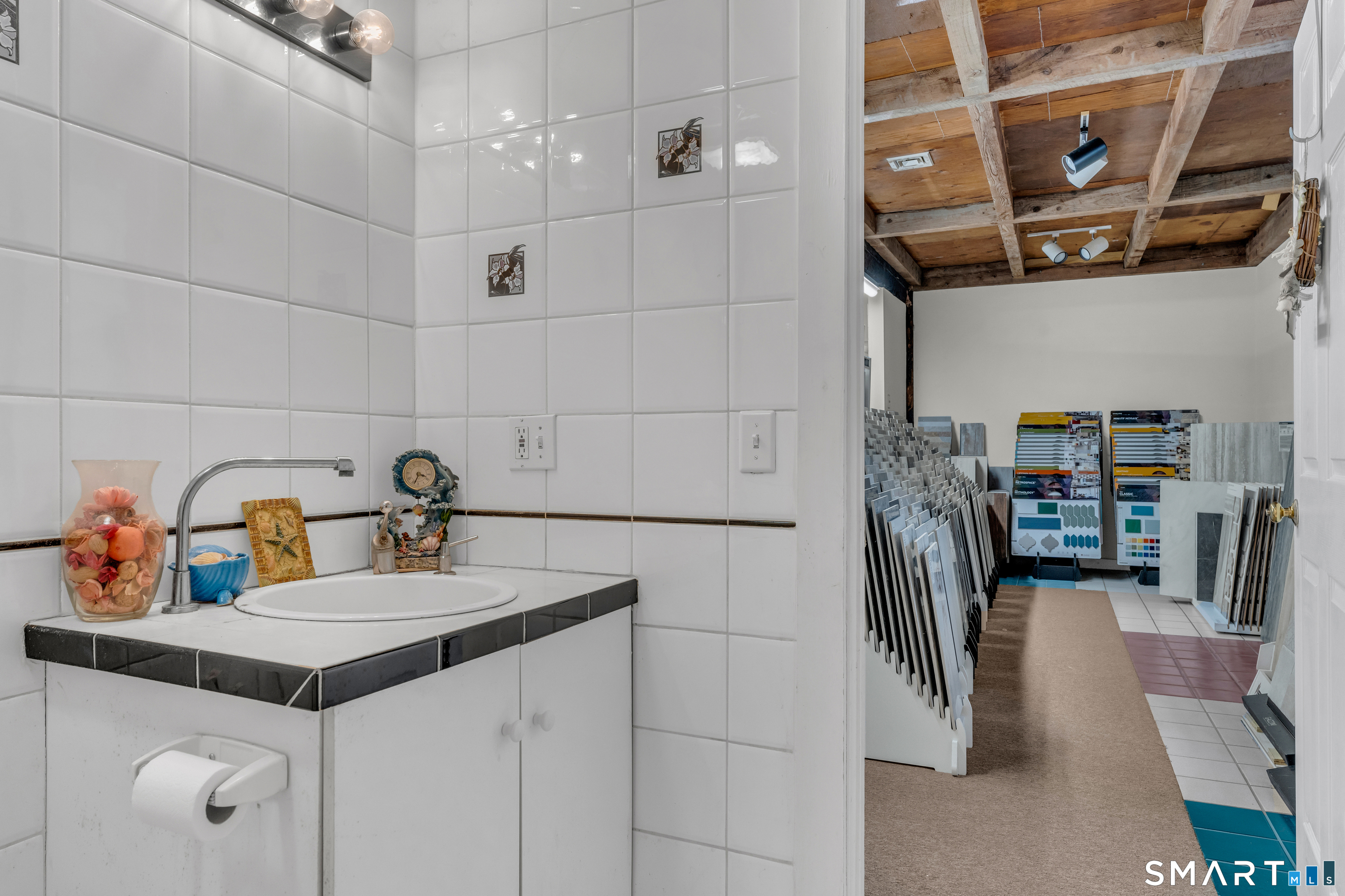 51 Mill Road Guilford, CT 06437 - Photo 21 of 28 a kitchen with a refrigerator and countertop