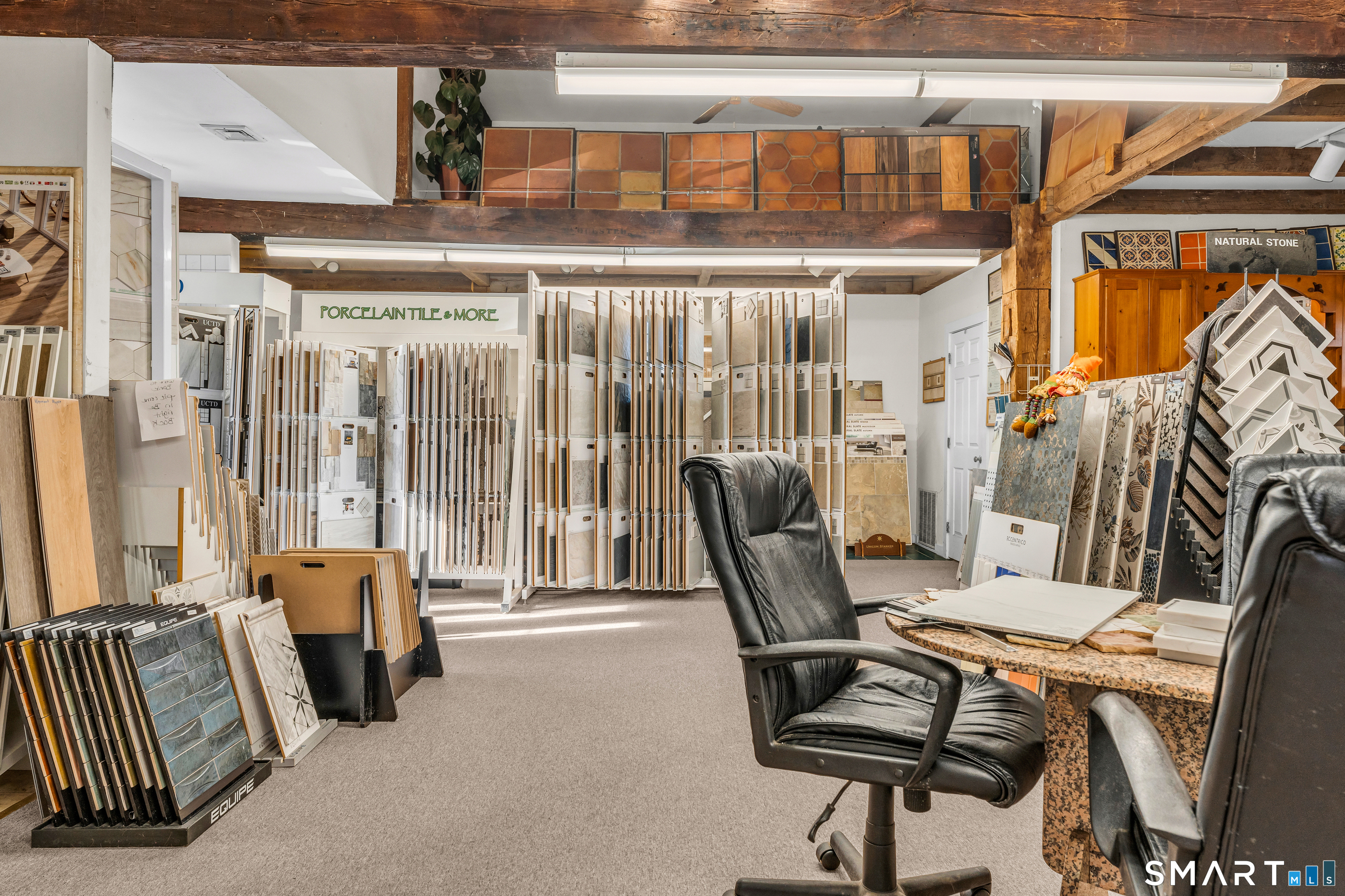 51 Mill Road Guilford, CT 06437 - Photo 22 of 28 a view of a livingroom with furniture and windows