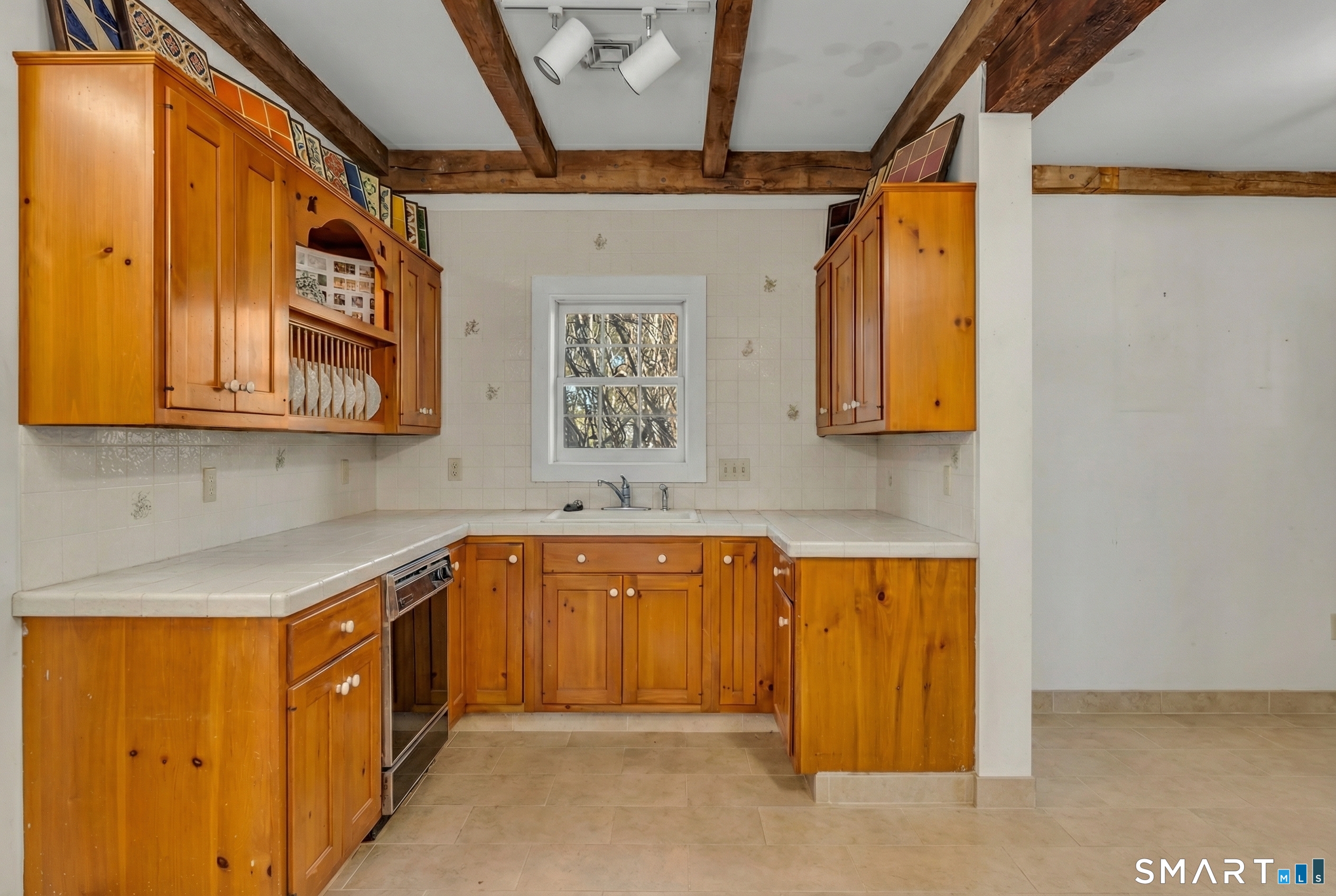 51 Mill Road Guilford, CT 06437 - Photo 4 of 30 a kitchen with stainless steel appliances granite countertop a sink and cabinets