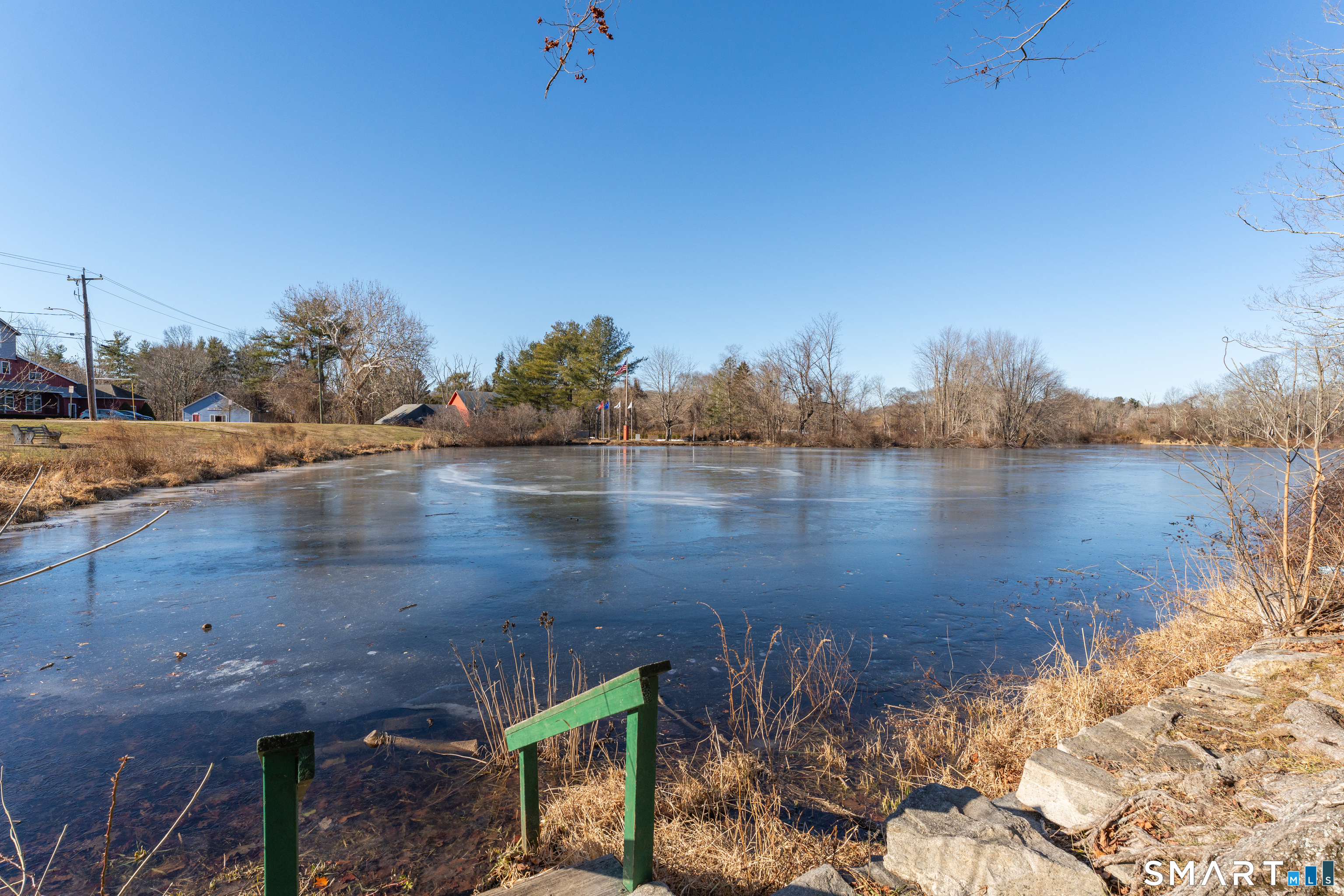 51 Mill Road Guilford, CT 06437 - Photo 5 of 28 a view of a lake with houses in the background