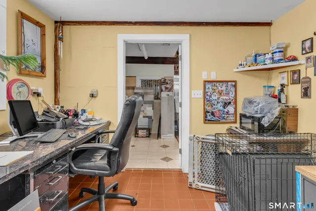 a view of a workspace with furniture and toys