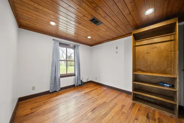 a house view with swimming pool in front of it