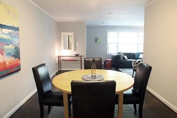 a view of a dining room with furniture and window