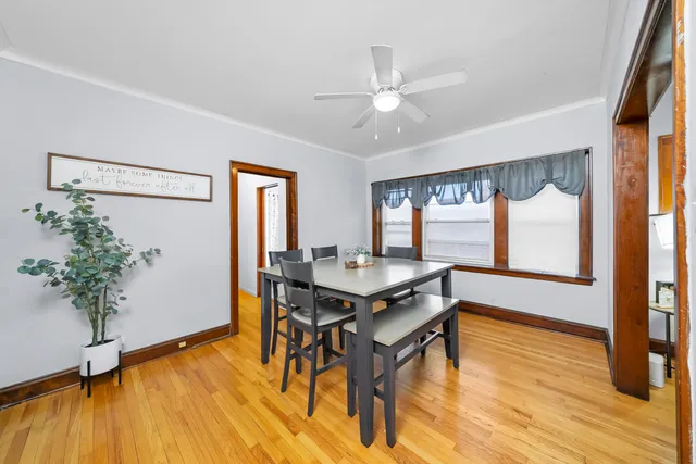 a view of a workspace with furniture window and wooden floor