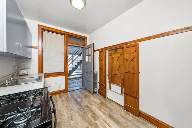 a kitchen with stainless steel appliances granite countertop a stove and a refrigerator