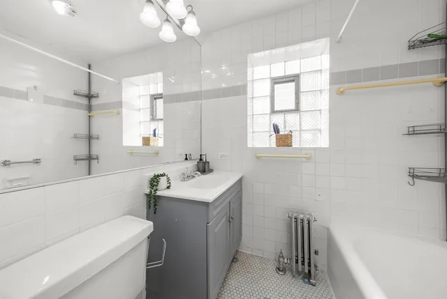 a bathroom with a sink a toilet and a bathtub