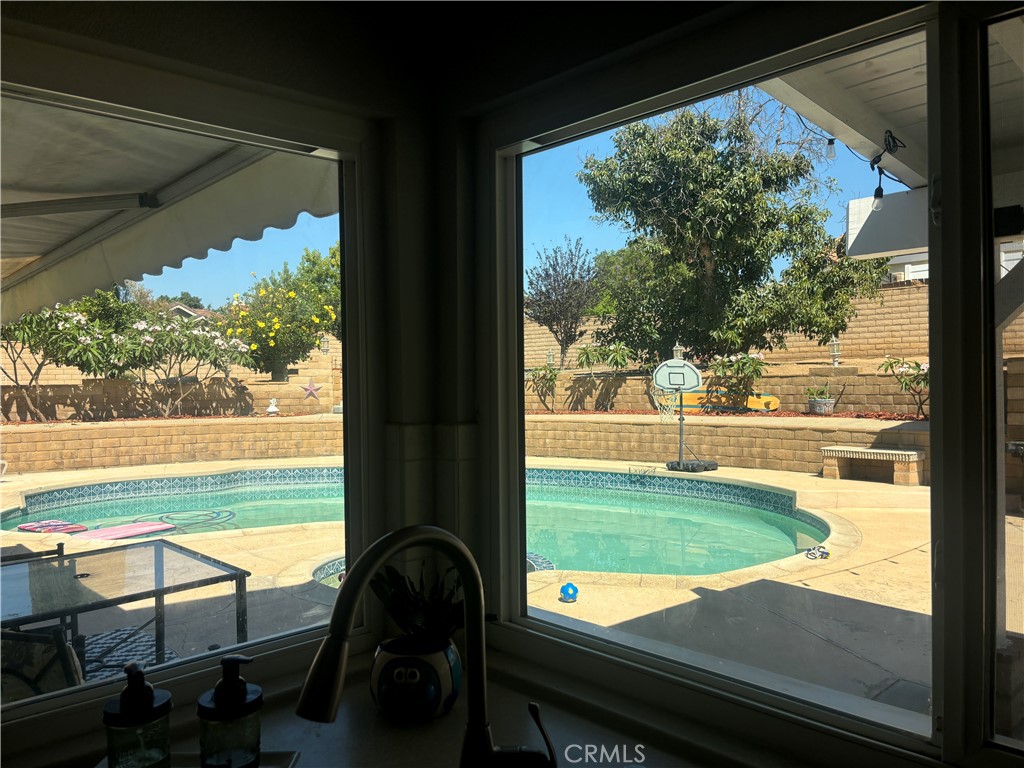 11010 Kayjay Street Riverside, CA 92503 - Photo 16 of 52 Kitchen and Breakfast Bar overlooking Pool
