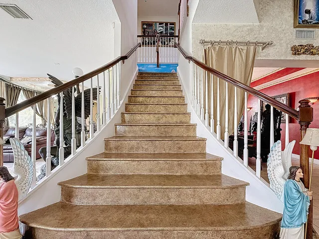 an aerial view of a house with outdoor space and lake view