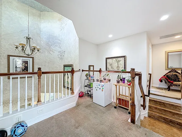 a sign broad in front of the green space