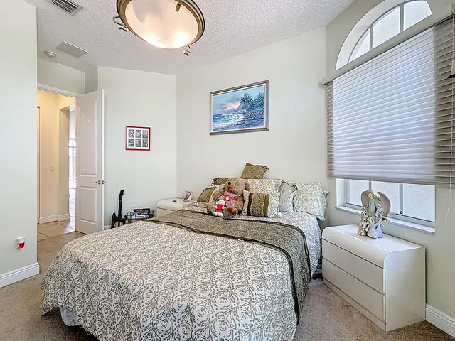 an aerial view of a house with a yard and garden