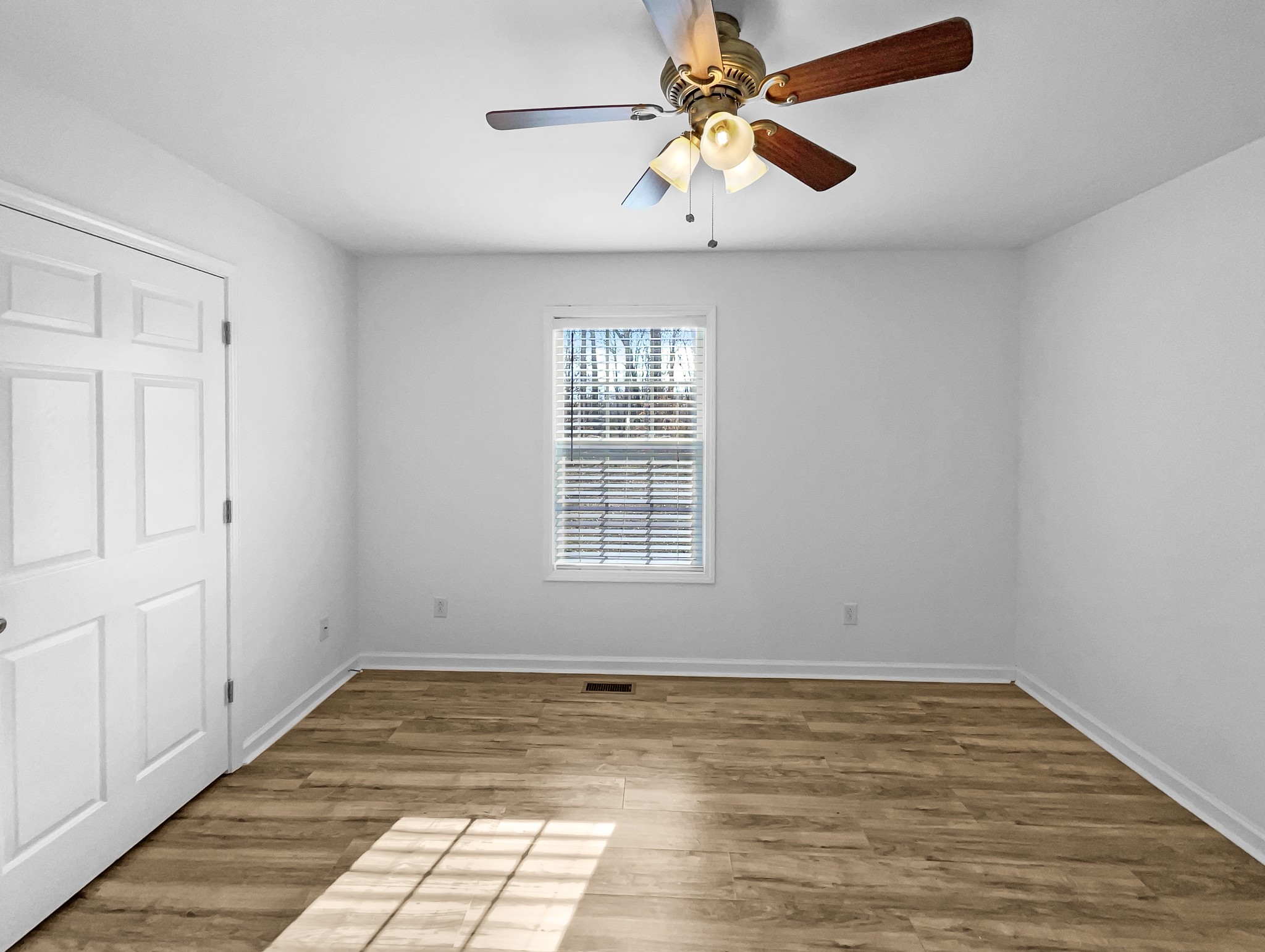 2284 Wiley Pardue Road Ashland City, TN 37015 - Photo 11 of 19 wooden floor in an empty room with a window