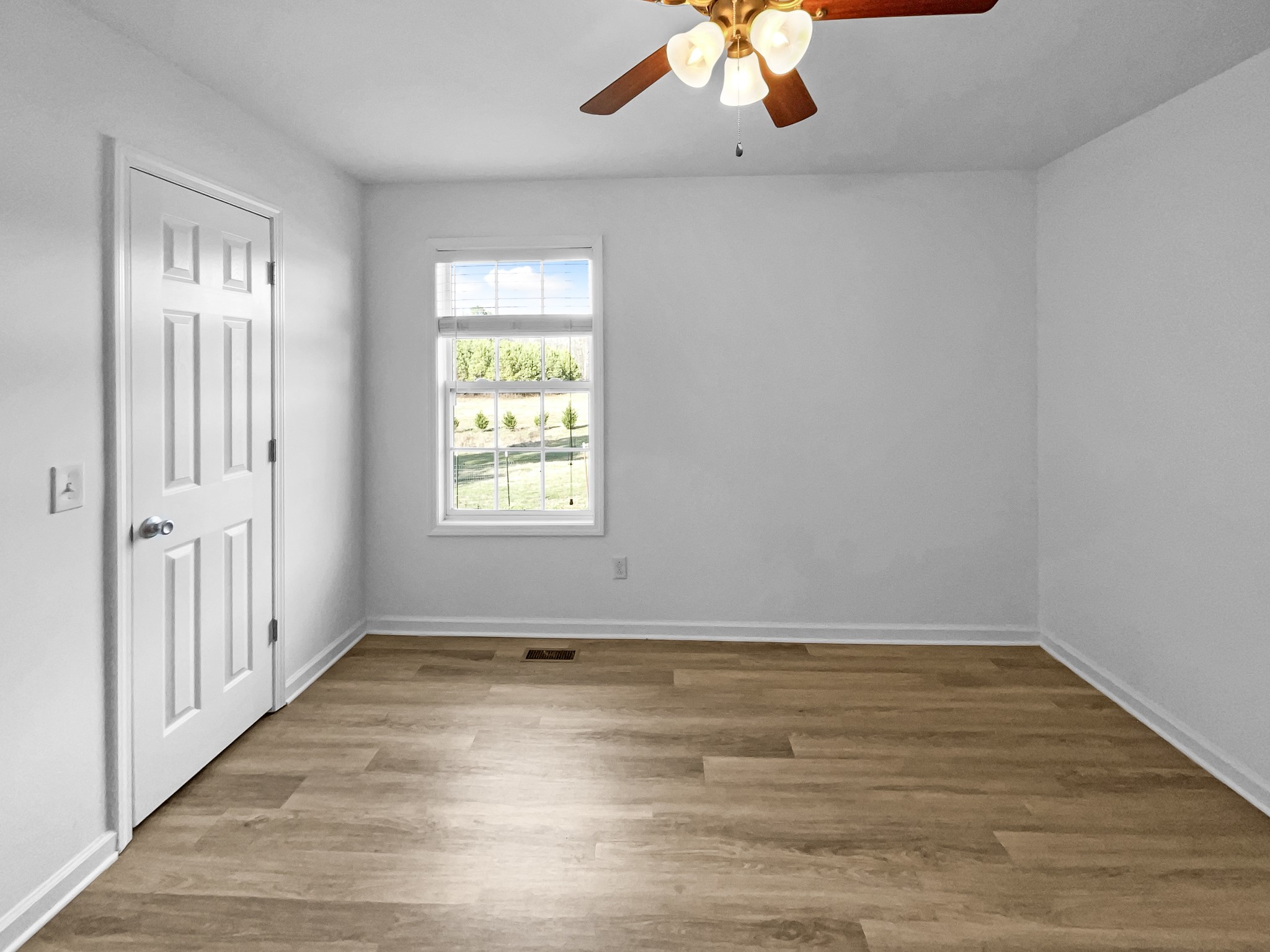 2284 Wiley Pardue Road Ashland City, TN 37015 - Photo 12 of 19 wooden floor in an empty room with a window