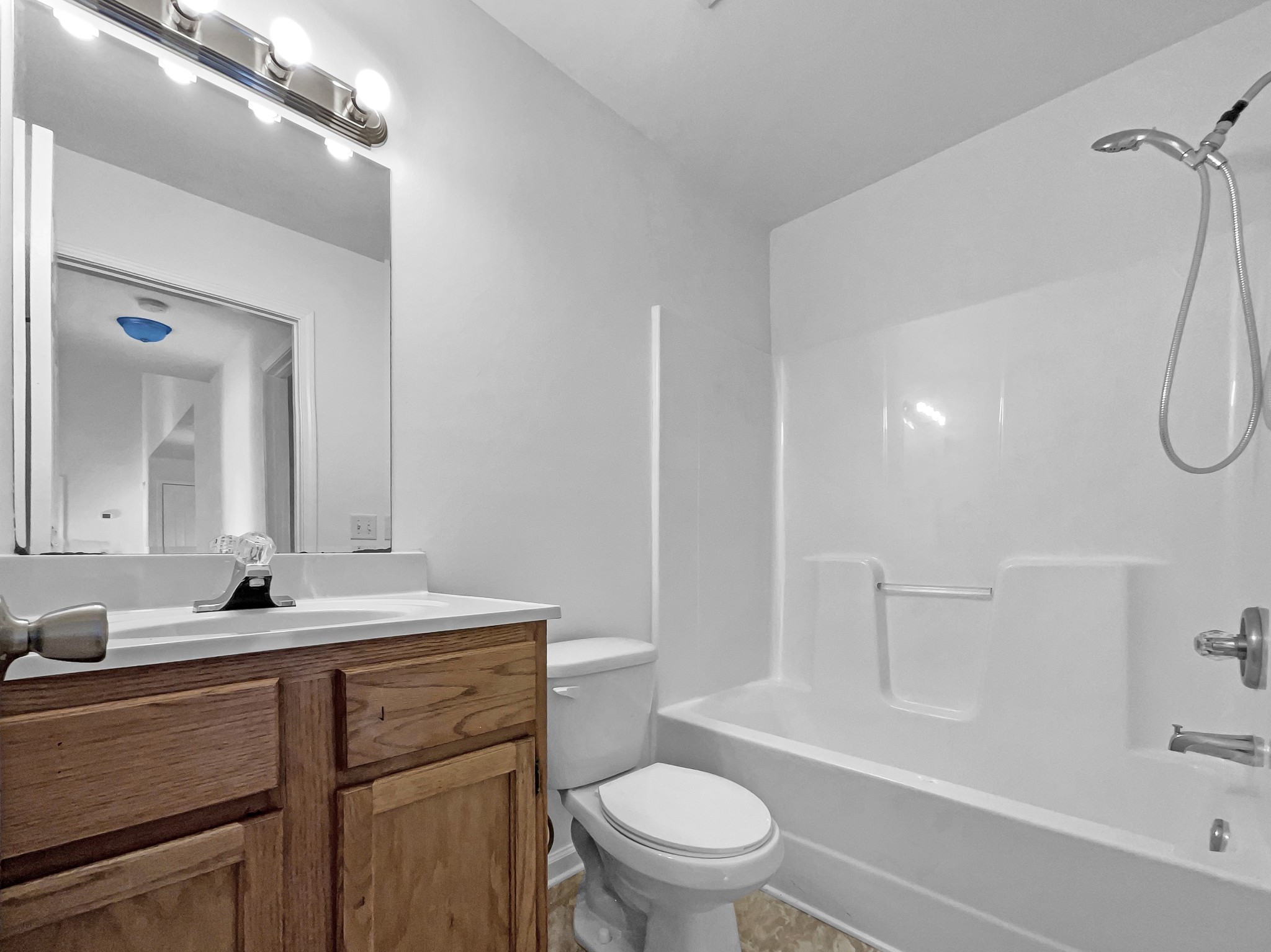 2284 Wiley Pardue Road Ashland City, TN 37015 - Photo 15 of 19 a bathroom with a sink a toilet and a bathtub