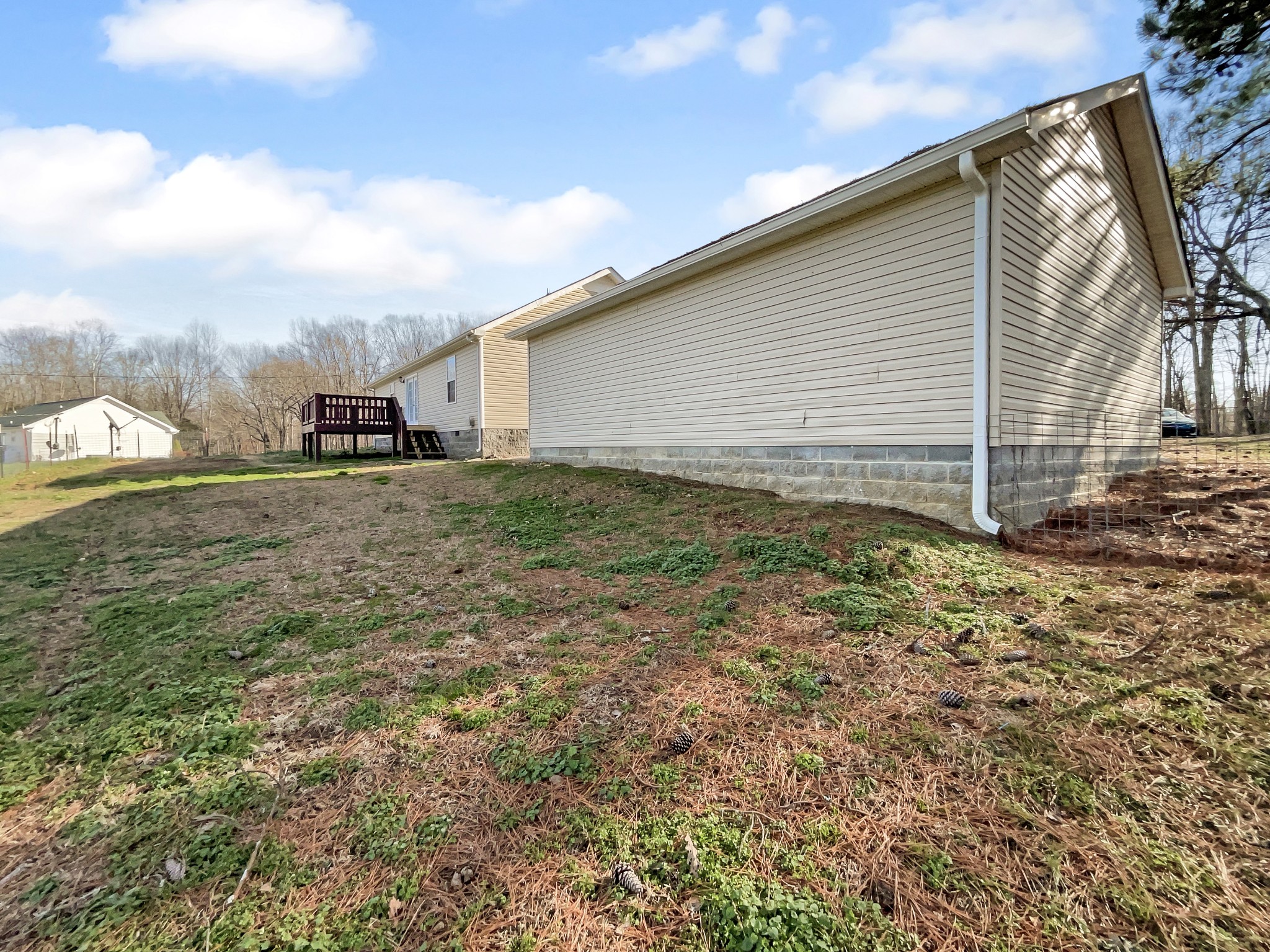 2284 Wiley Pardue Road Ashland City, TN 37015 - Photo 17 of 19 a view of a house with backyard and trees