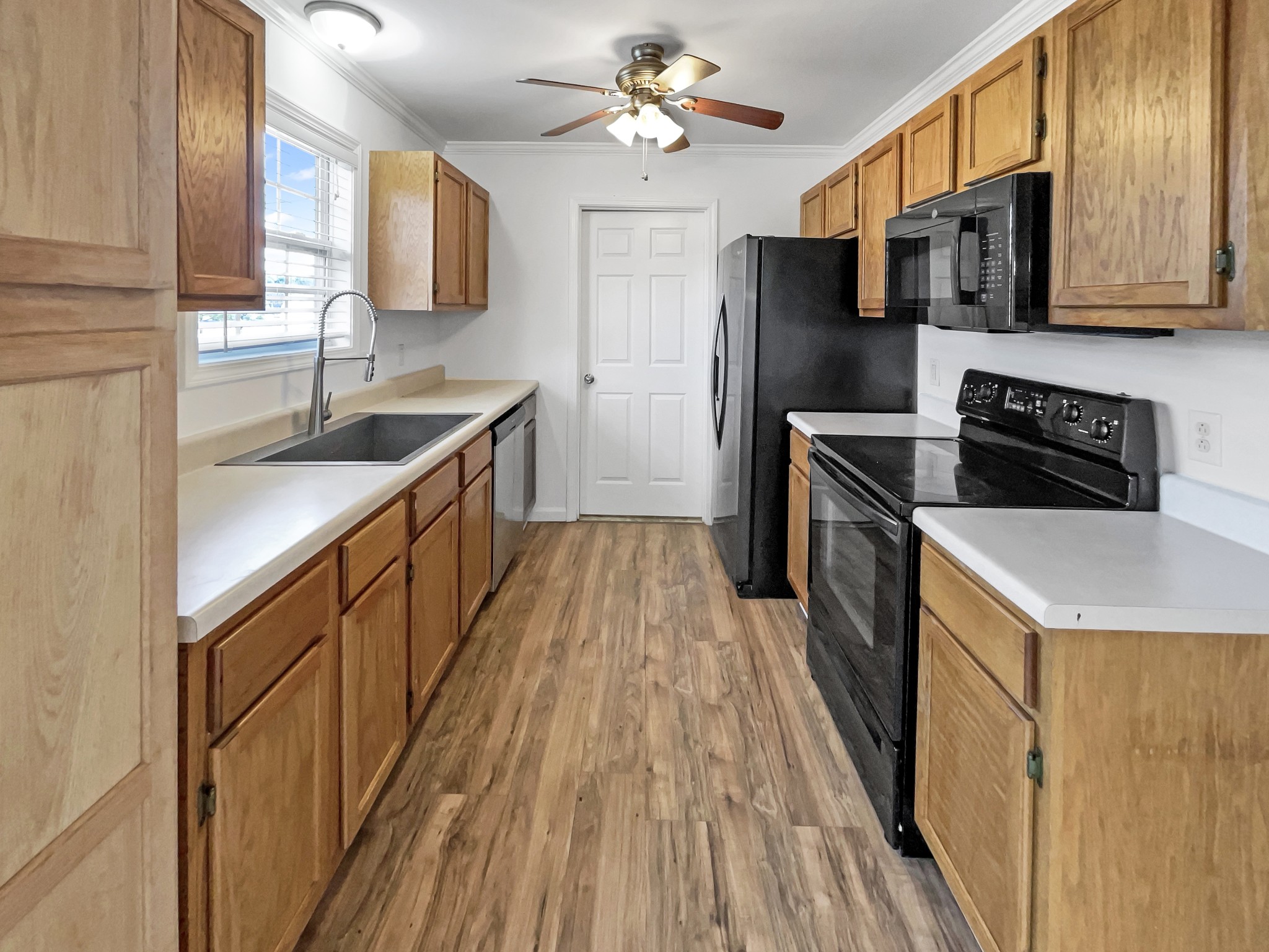2284 Wiley Pardue Road Ashland City, TN 37015 - Photo 6 of 19 a kitchen with stainless steel appliances granite countertop a sink stove and refrigerator