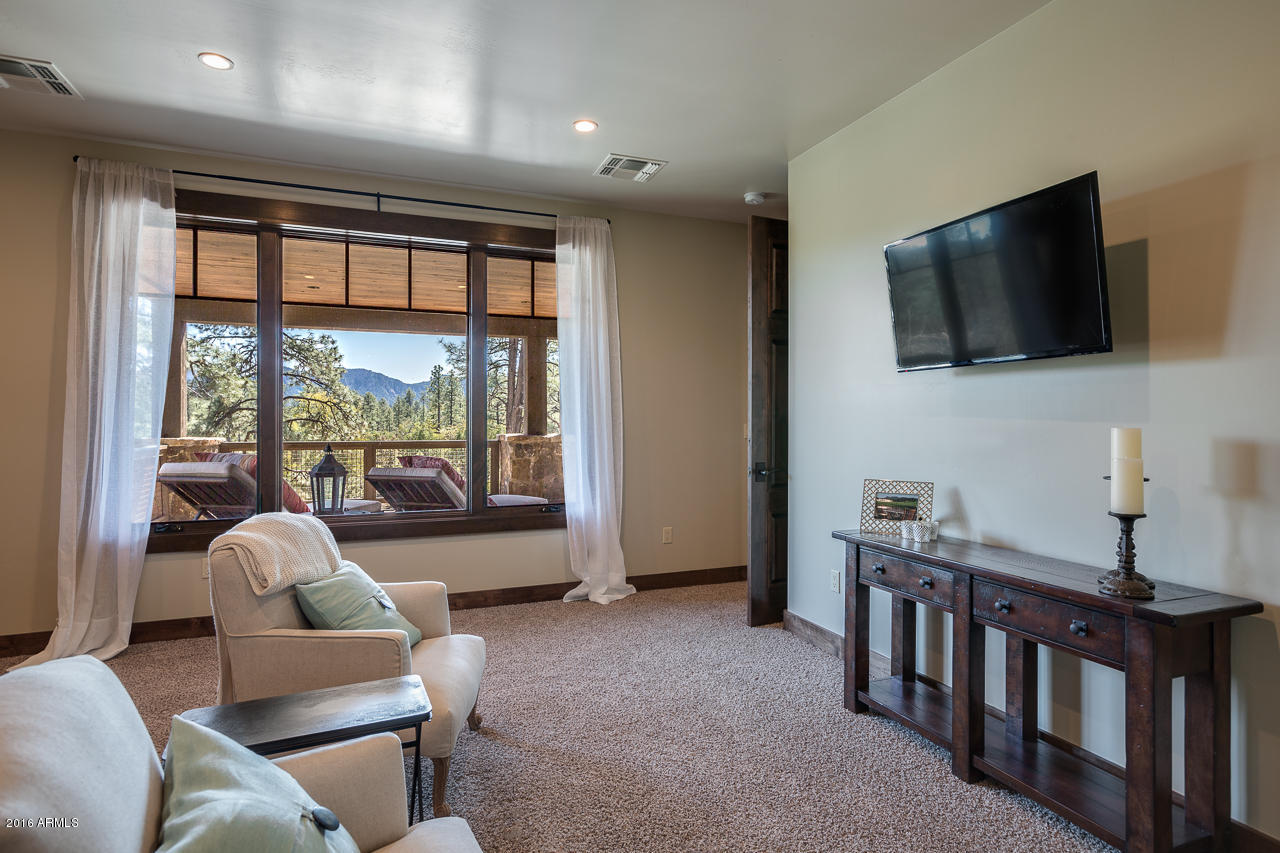 3003 East Arrow Point Payson, AZ 85541 - Photo 21 of 36 a living room with furniture and a flat screen tv