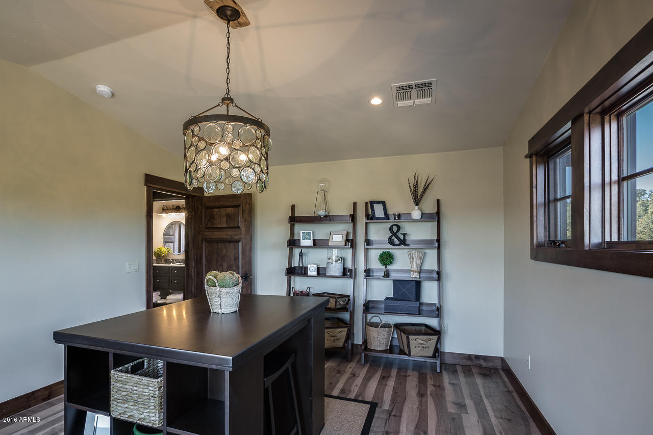 3003 East Arrow Point Payson, AZ 85541 - Photo 24 of 36 a view of a dining room with furniture and wooden floor