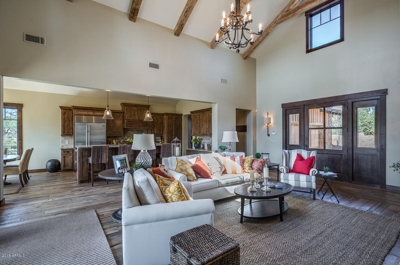 3003 East Arrow Point Payson, AZ 85541 - Photo 3 of 36 a living room with patio furniture and a chandelier