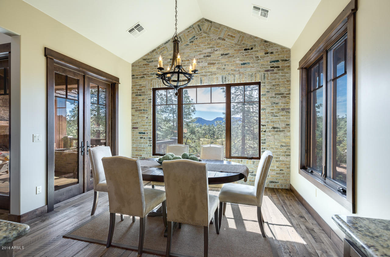 3003 East Arrow Point Payson, AZ 85541 - Photo 6 of 36 a view of a dining room with furniture wooden floor and chandelier