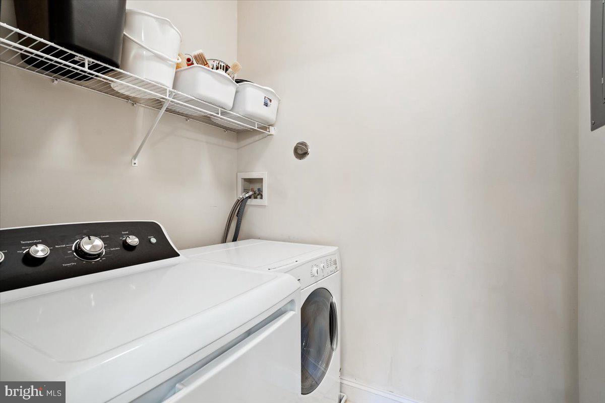 2250 Bear Den Road, Unit 313 Frederick, MD 21701 - Photo 18 of 59 a utility room with dryer and washer