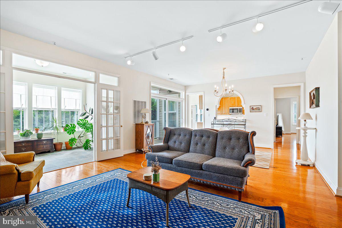 2250 Bear Den Road, Unit 313 Frederick, MD 21701 - Photo 2 of 59 a living room with furniture and a table