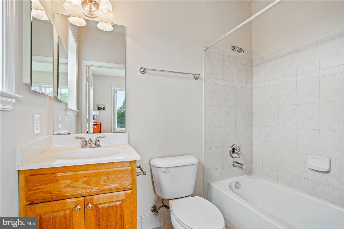 2250 Bear Den Road, Unit 313 Frederick, MD 21701 - Photo 21 of 59 a bathroom with a sink a toilet and shower