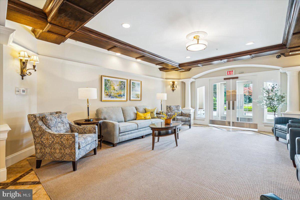 2250 Bear Den Road, Unit 313 Frederick, MD 21701 - Photo 26 of 59 a living room with furniture and a large window