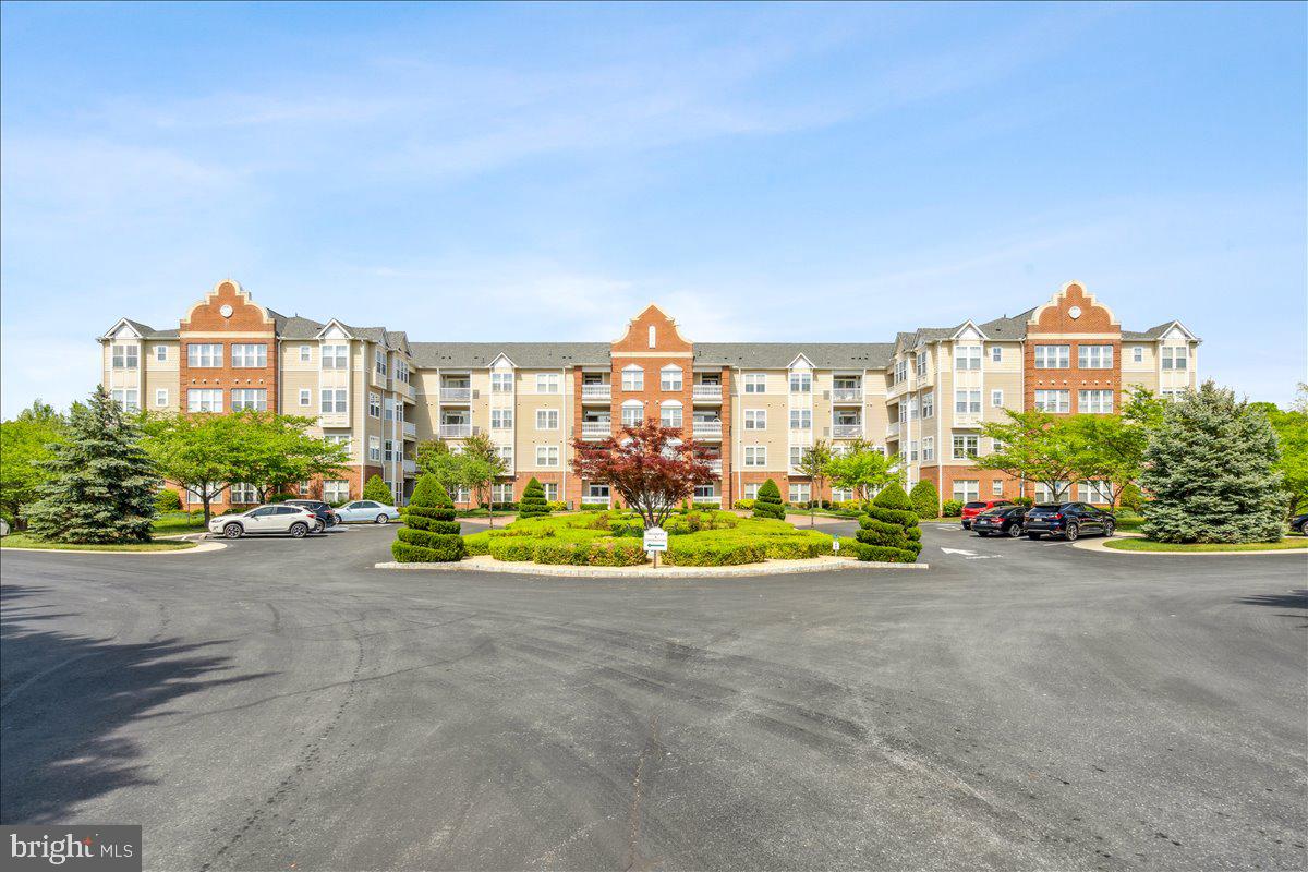 2250 Bear Den Road, Unit 313 Frederick, MD 21701 - Photo 28 of 59 a view of a house with a yard and sitting area