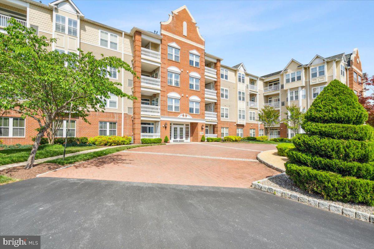 2250 Bear Den Road, Unit 313 Frederick, MD 21701 - Photo 31 of 59 front view of a building with a street